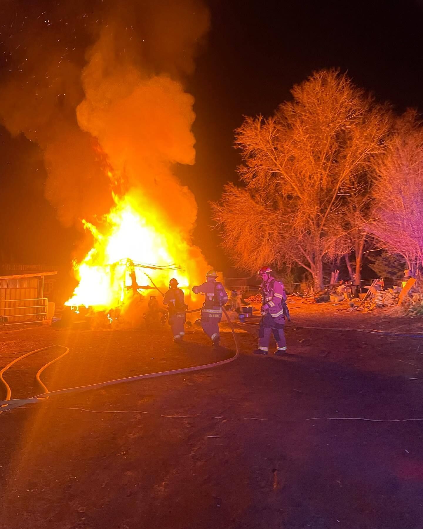 A large fire consumes a camper trailer in Flagstaff