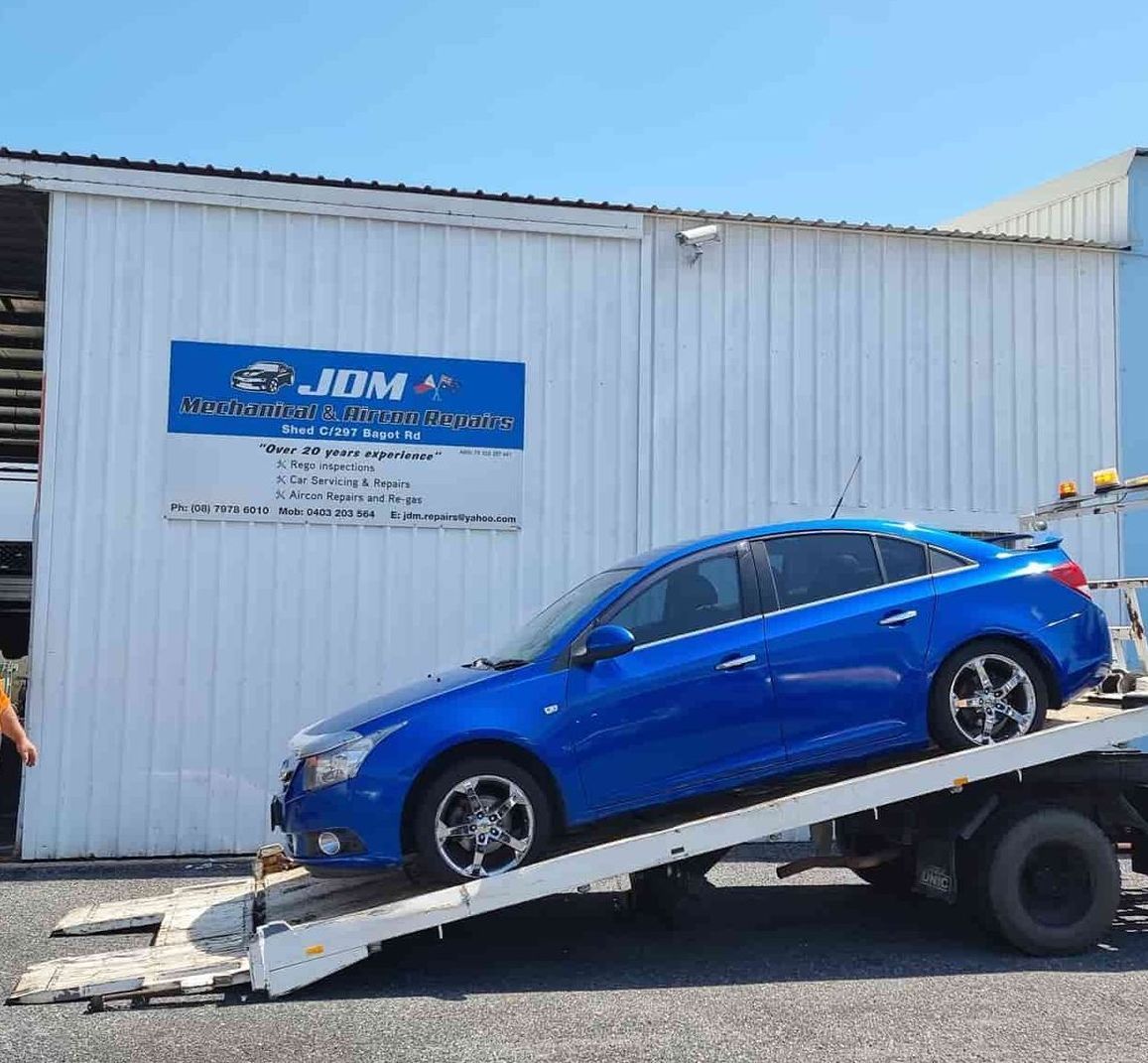 A Blue Car is Sitting on Top of a Tow Truck — JDM Mechanical & Aircon Repairs In Coconut Grove, NT