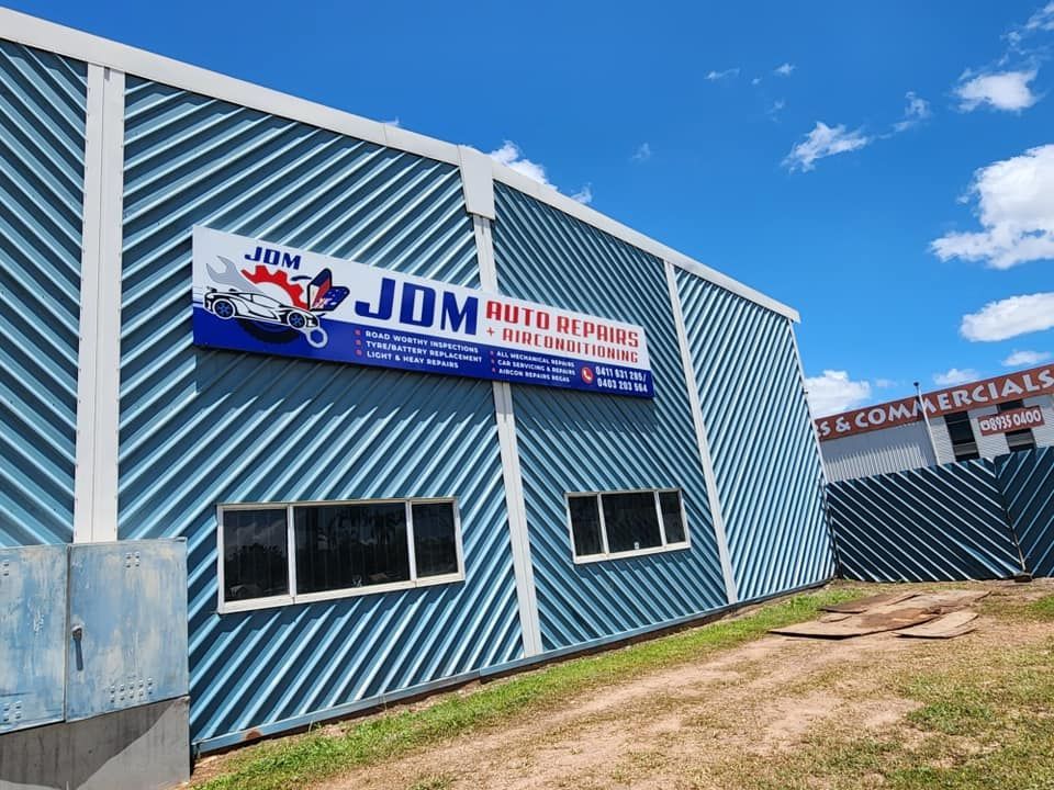 Building With the Company Sign — JDM Mechanical & Aircon Repairs In Coconut Grove, NT
