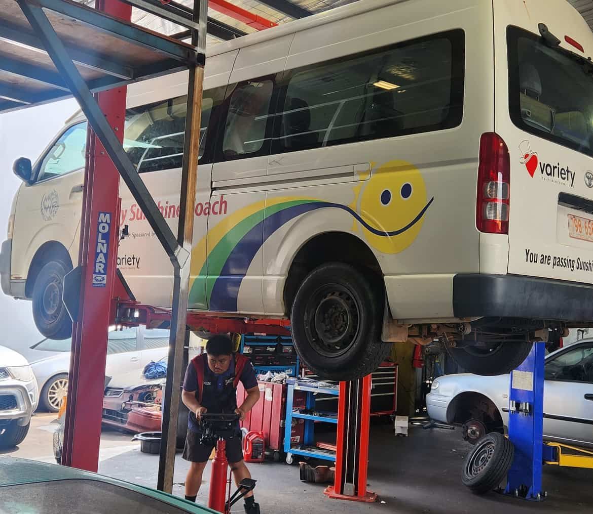 A White Van Being Repaired in a Garage — JDM Mechanical & Aircon Repairs In Coconut Grove, NT