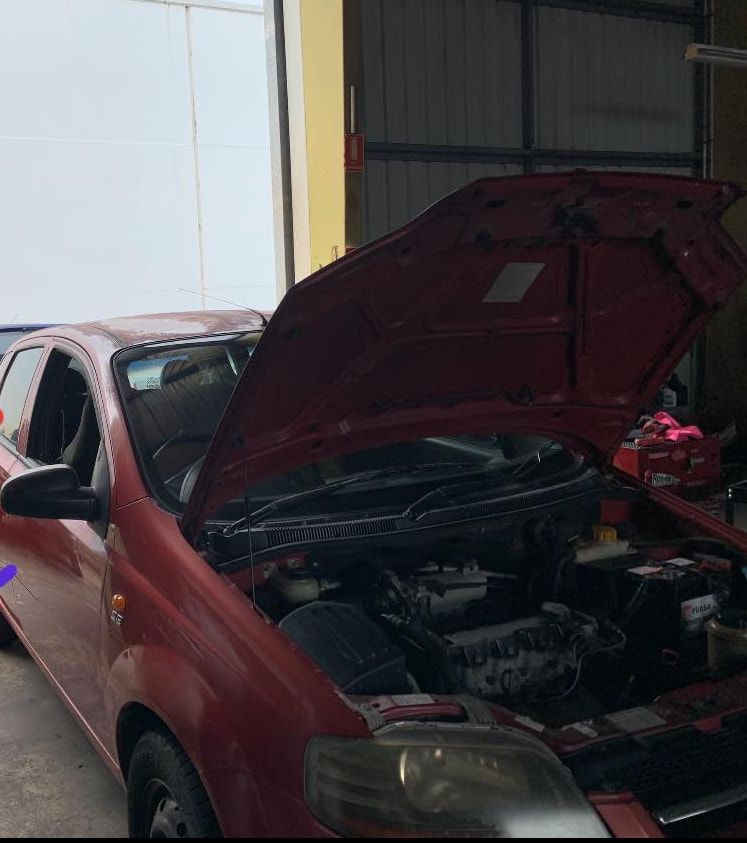 A Red Car With the Hood Open in a Garage — JDM Mechanical & Aircon Repairs In Coconut Grove, NT