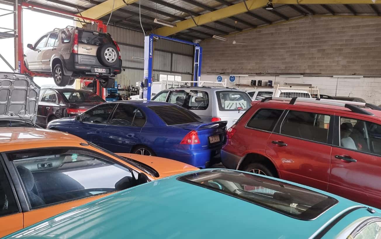 A Bunch of Cars Are Parked in a Garage — JDM Mechanical & Aircon Repairs In Coconut Grove, NT