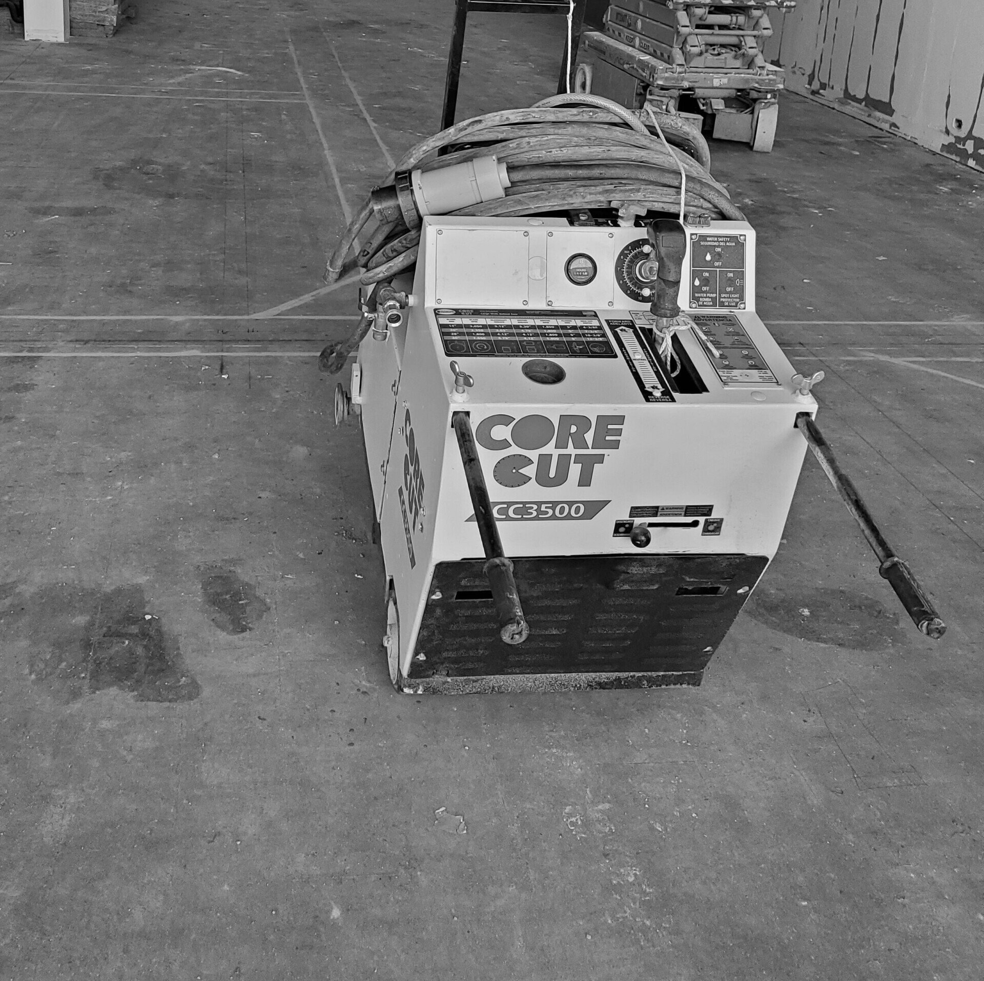 A black and white photo of a core cut machine