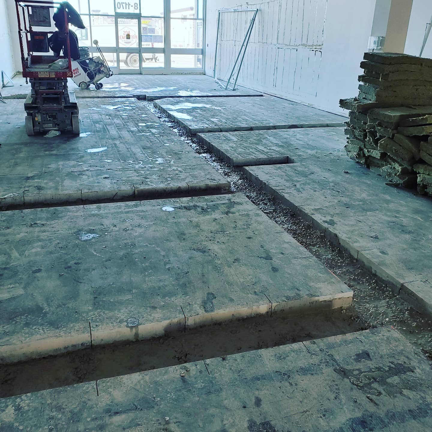 A concrete floor is being installed in a building