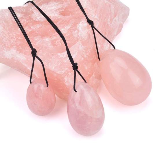 Rose quartz yoni egg, symbol of feminine healing.