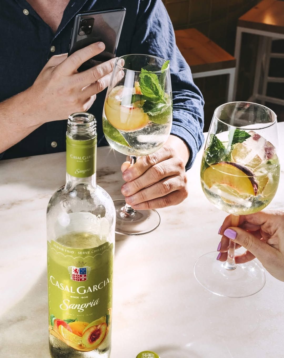 A Bottle Of Casa Garcia Wine Is Sitting On A Table Next To Two Glasses Of Wine — Casa Portugal In South Hurstville, NSW