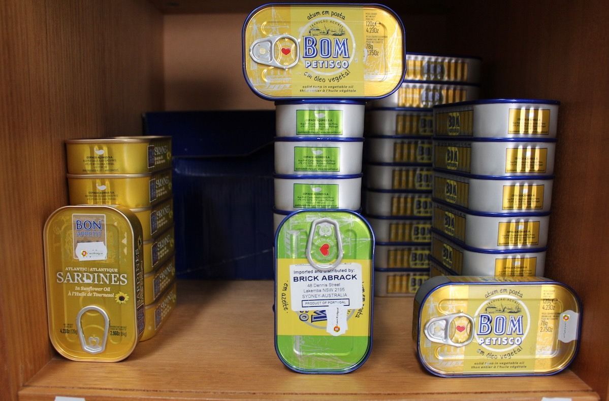 A Shelf Filled With Lots Of Cans Of Food Including Sardines — Casa Portugal In South Hurstville, NSW