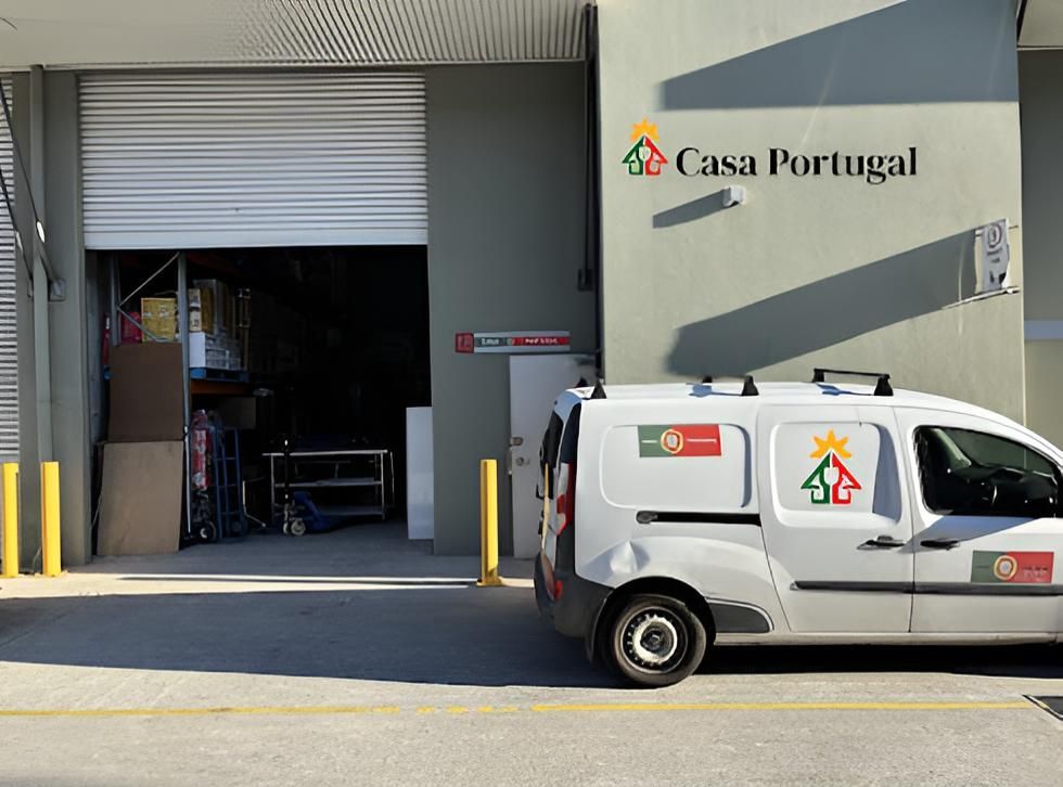 A White Van Is Parked In Front Of A Building That Says Casa Portugal — Casa Portugal In South Hurstville, NSW