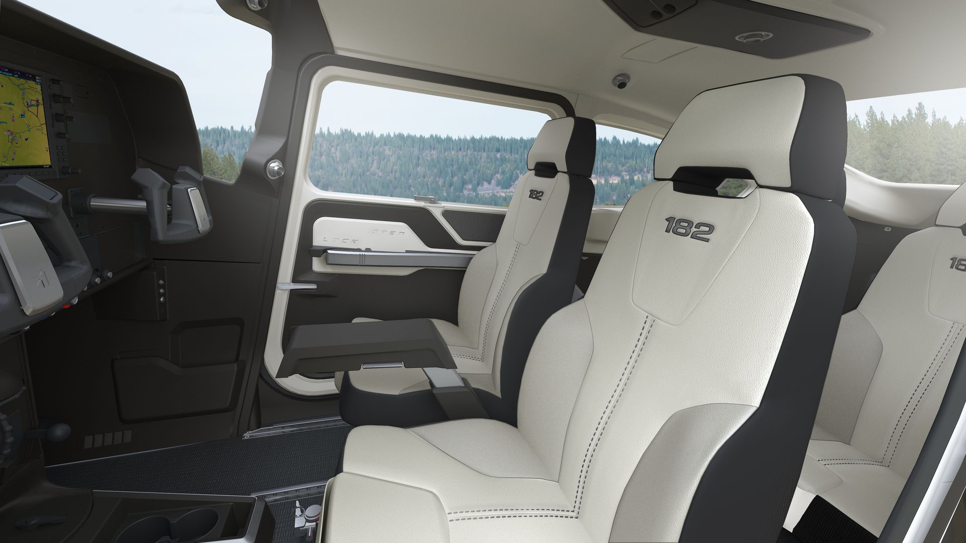 The interior of a car with white seats and a gps display