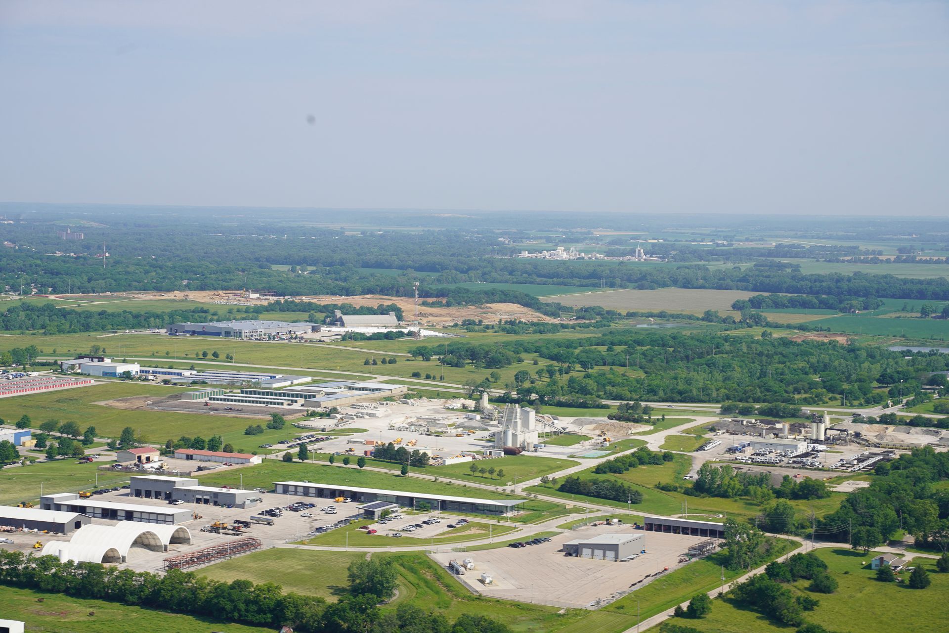 An aerial view of a city with lots of buildings and trees