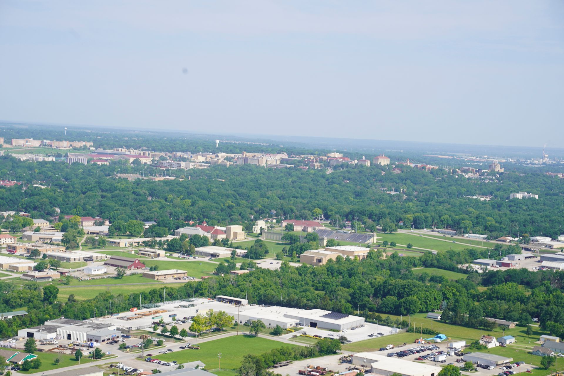 An aerial view of a city with lots of buildings and trees