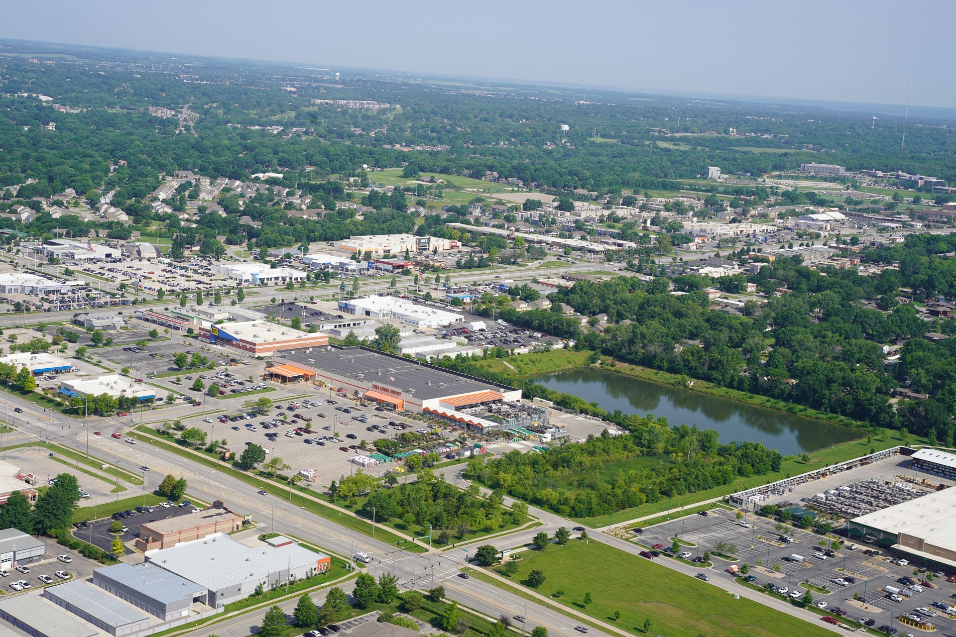 An aerial view of a city with a lake in the middle