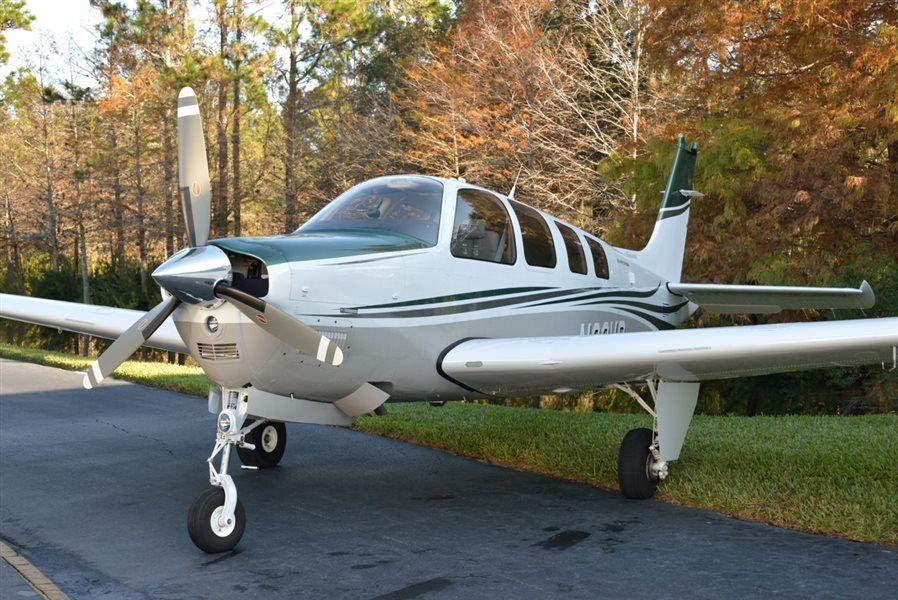 A small propeller plane is sitting on a runway.