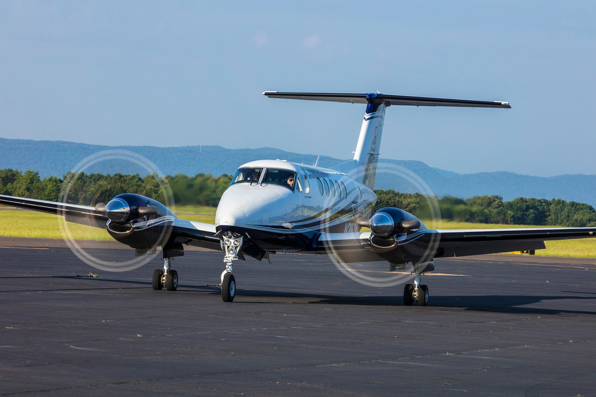 A small propeller plane is sitting on a runway.