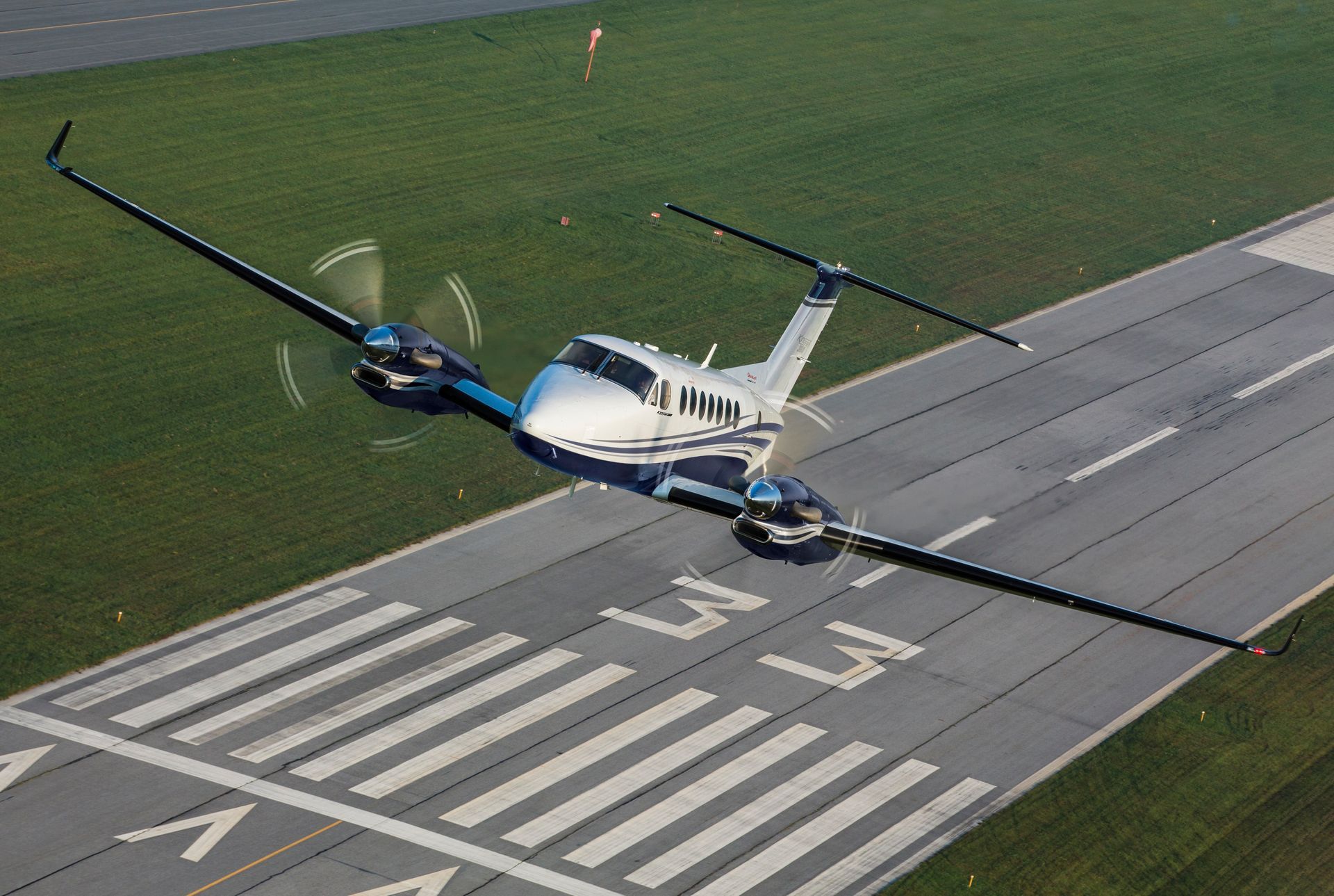 A small propeller plane is sitting on a runway.