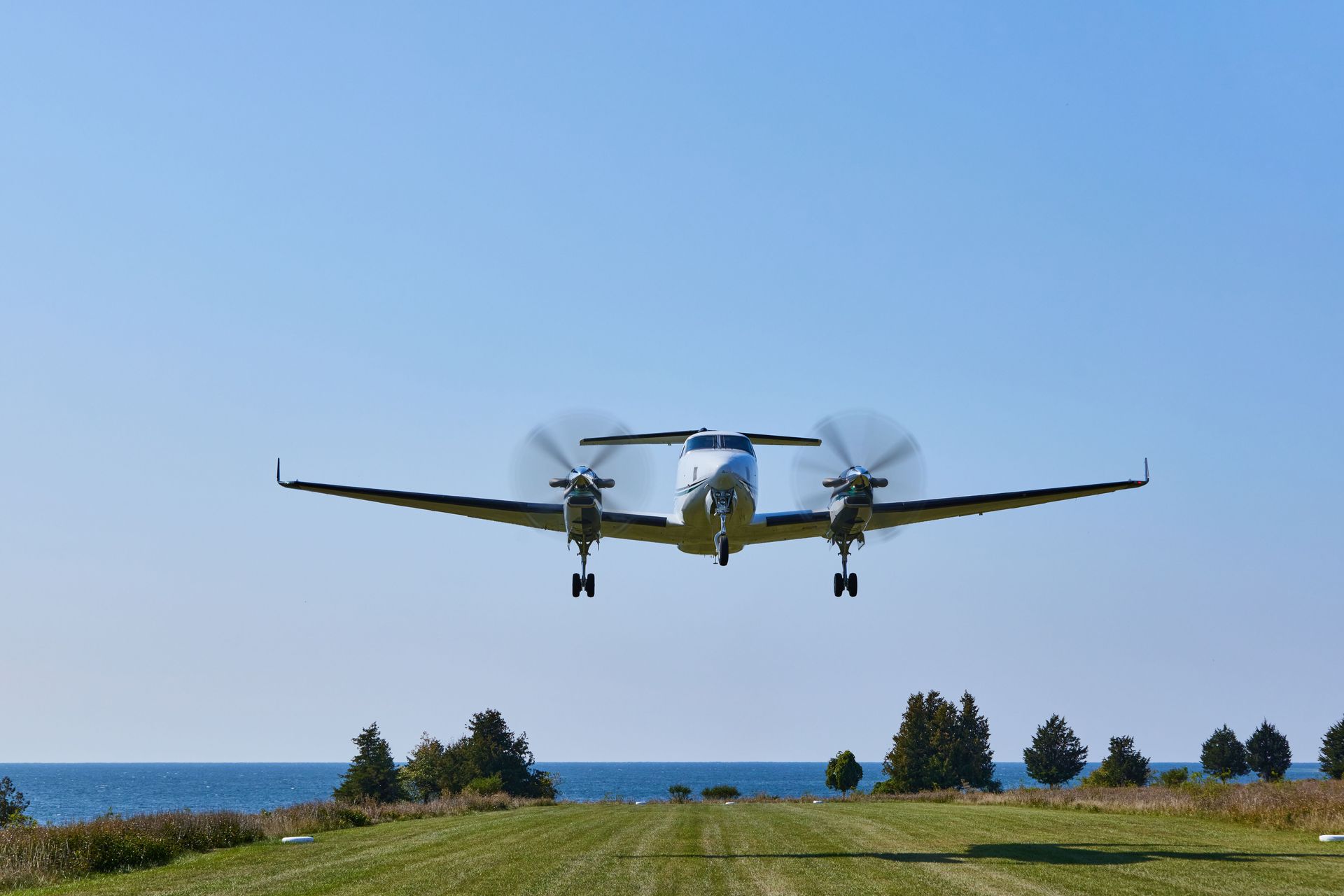 A small propeller plane is sitting on a runway.