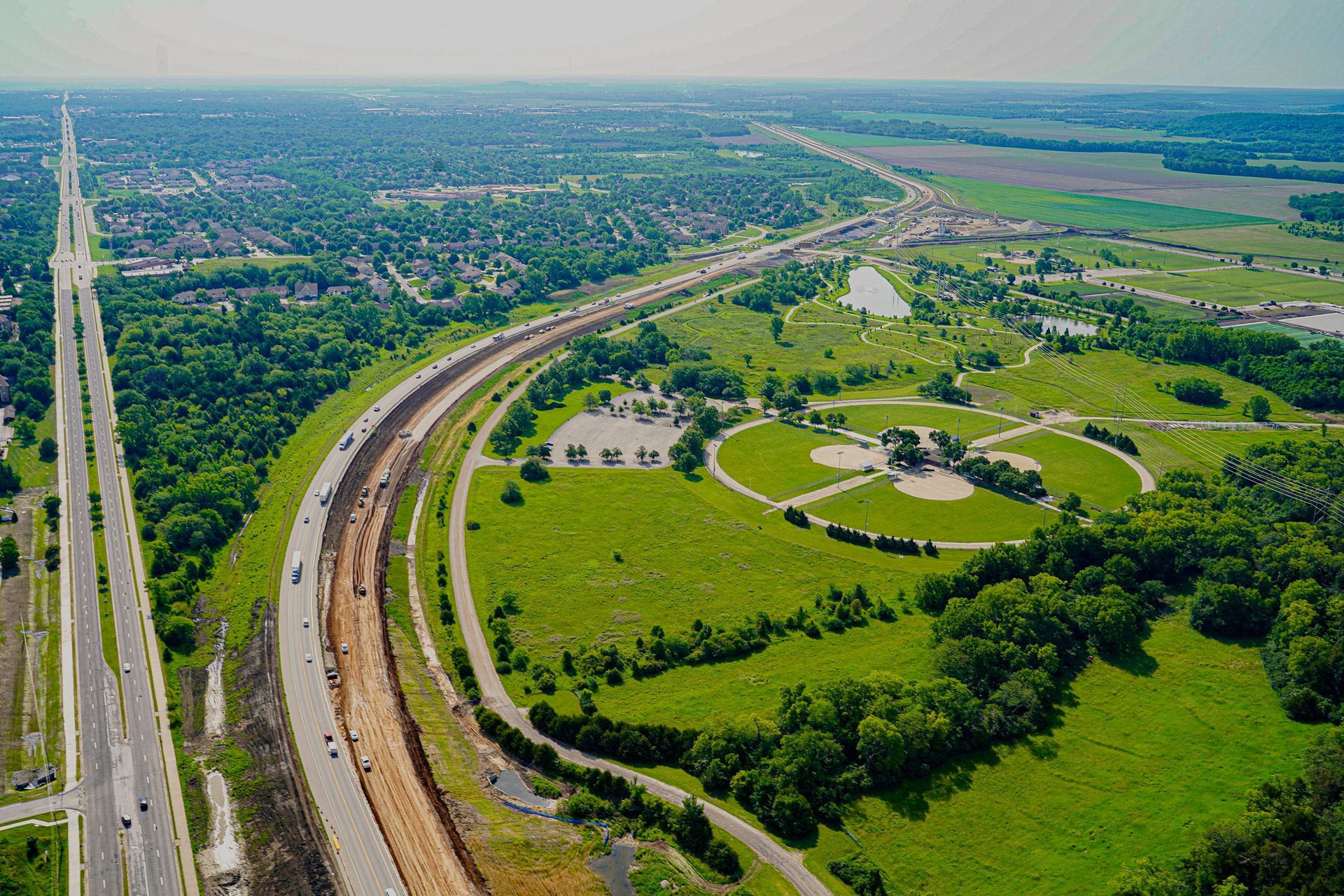 K 10 Highway Aerial Photography by Hetrick Air Service Lawrence with green grass and clear sky