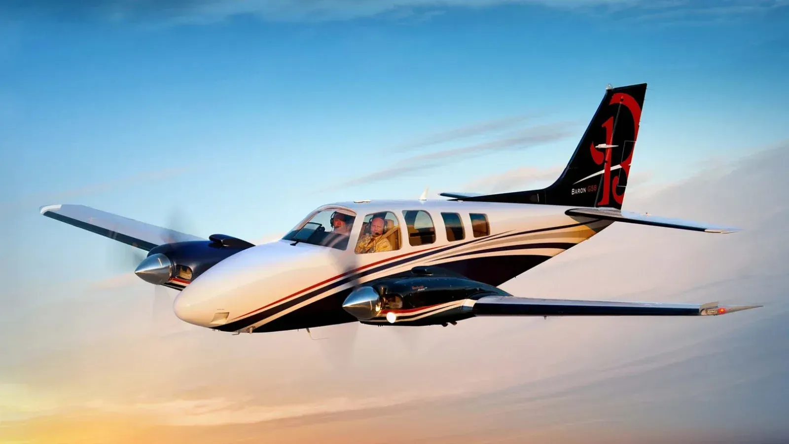 A small propeller plane is parked on a runway
