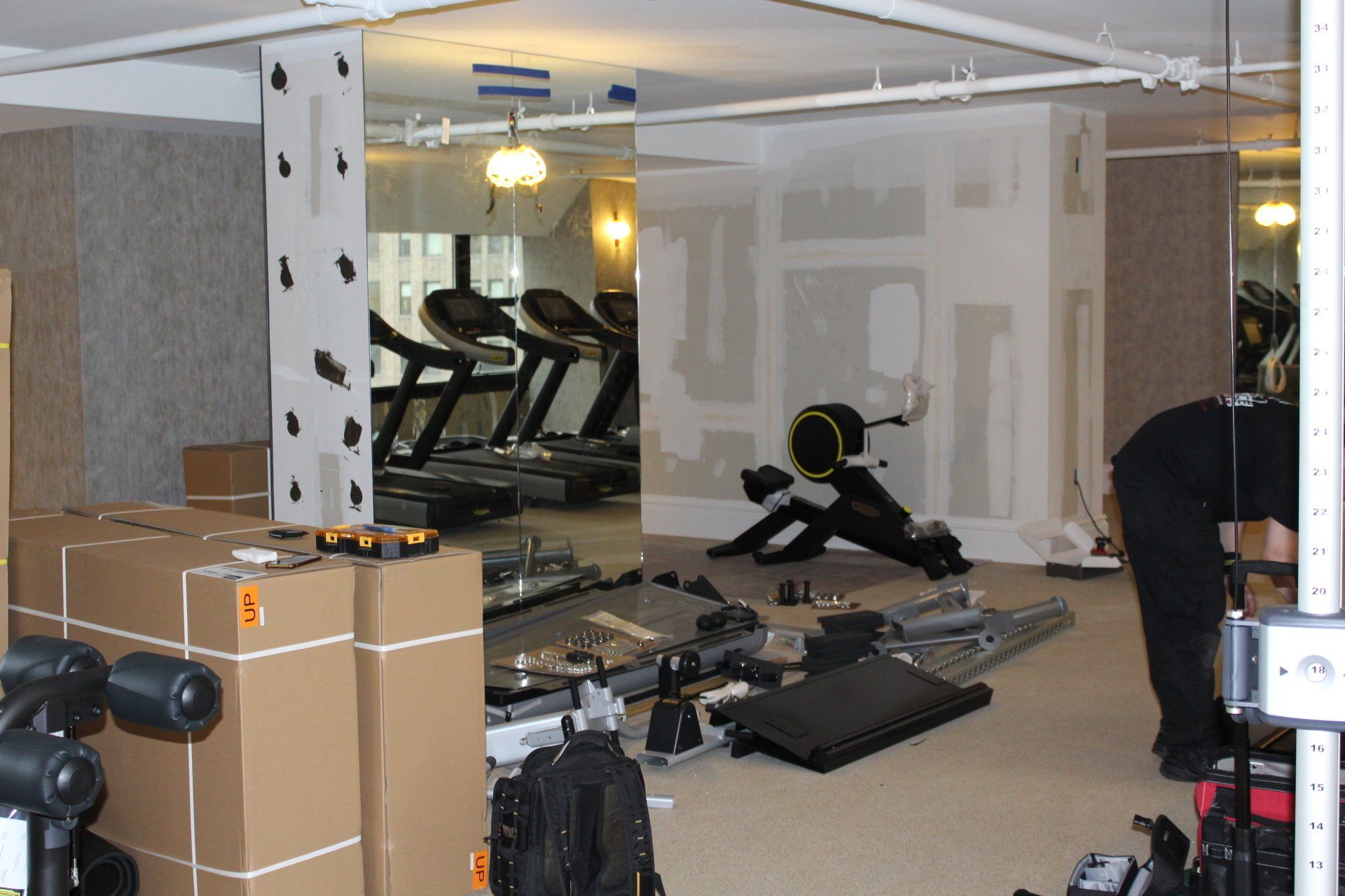 Fitness equipment being unpacked at Lotte New York Palace gym.