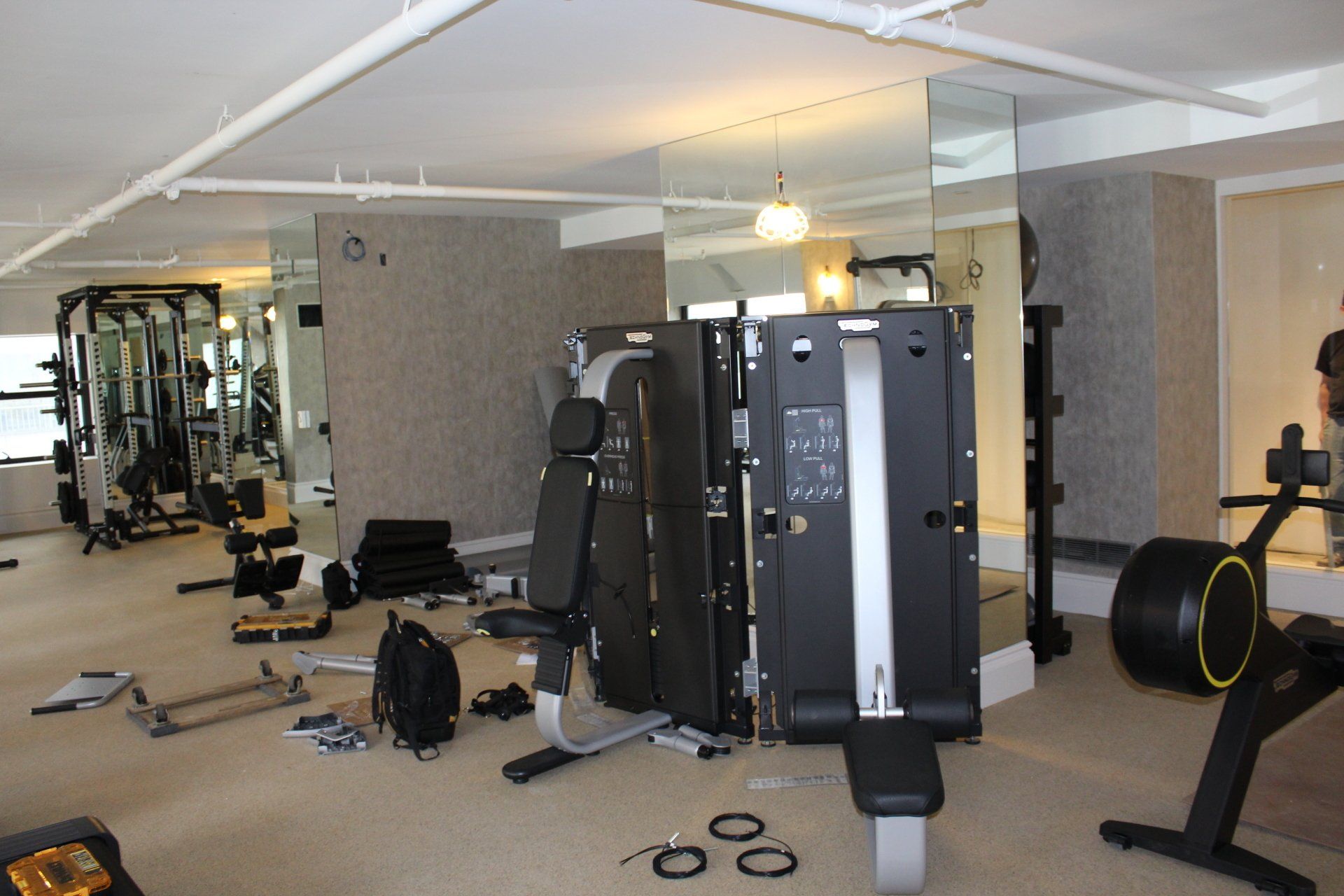 Weight machines and mirrors inside the Lotte New York Palace hotel gym.