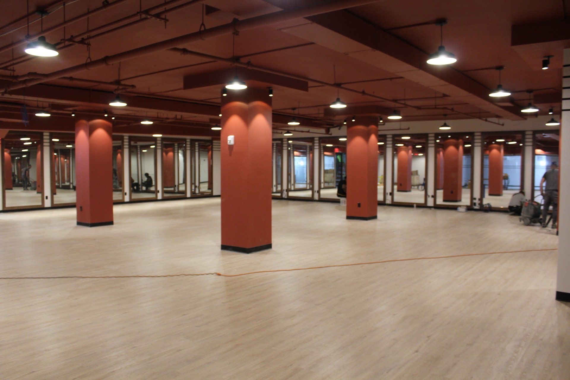 Large open event space with red pillars inside Twenty Exchange Place.
