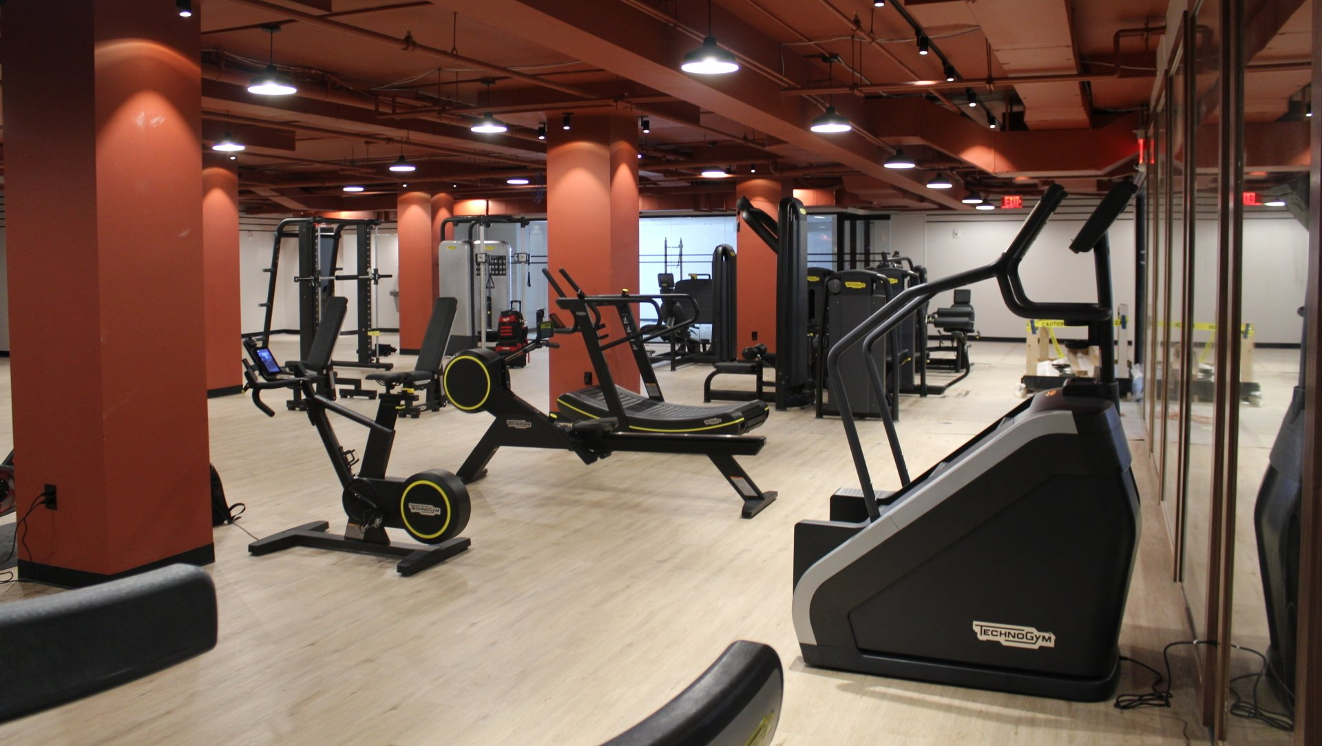 Fitness center at Twenty Exchange Place with modern gym equipment and weights.
