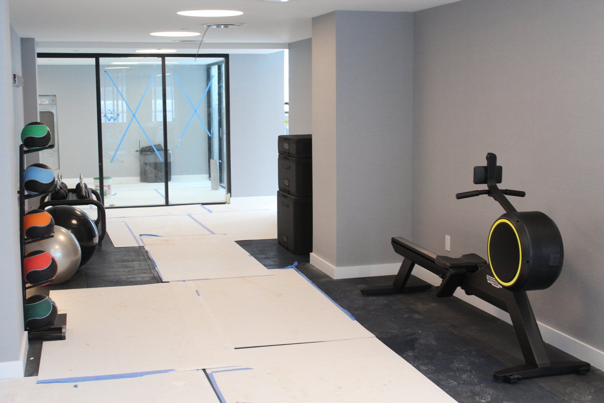 Quay Tower fitness area featuring exercise balls, bench, and rowing machine.