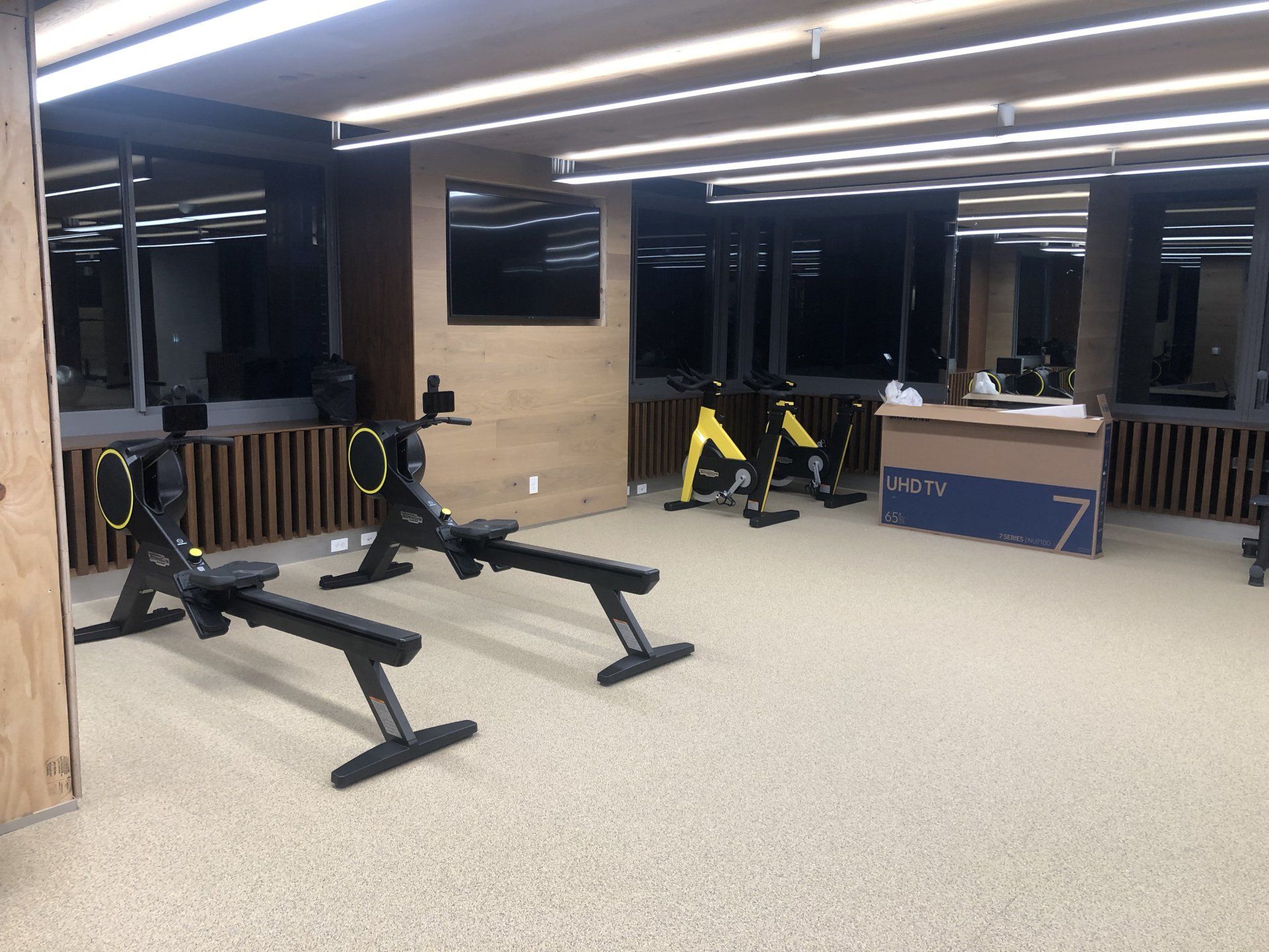 Strength training area with benches and free weights at Iron State.