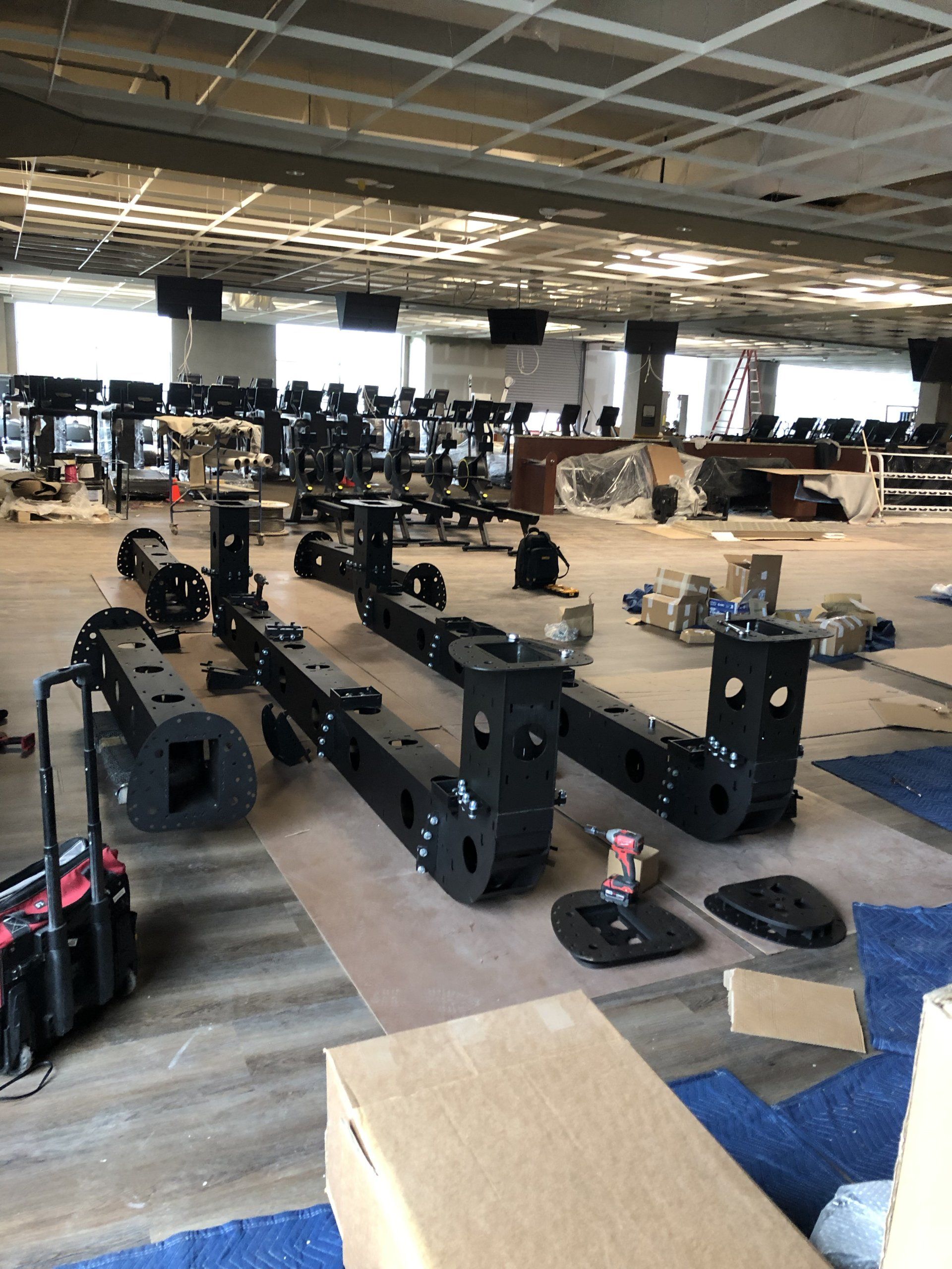 Lifetime Athletics facility with new strength training equipment being set up