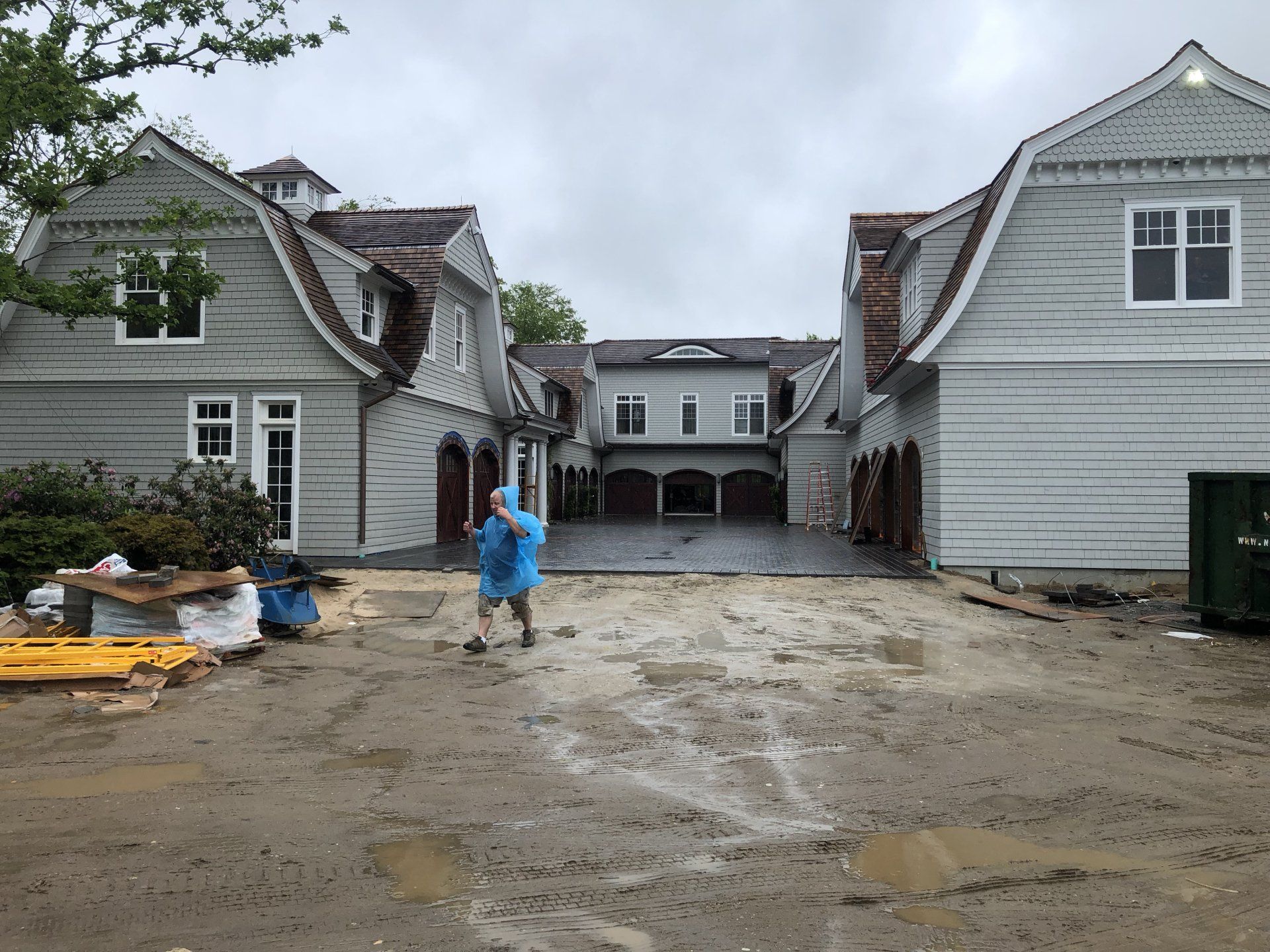Large residential driveway build with workers at Bridgehampton property