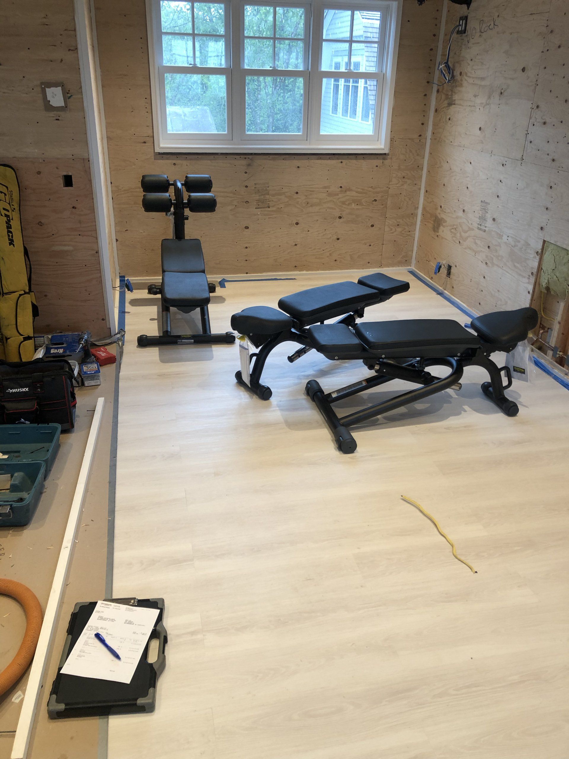 Weight benches installed in residential gym during Bridgehampton home project.