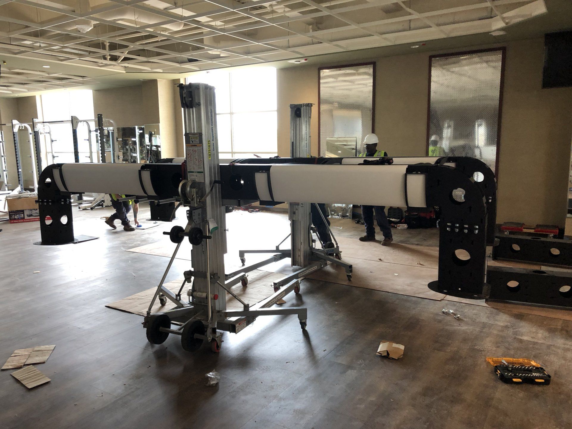 Partially assembled gym machines during installation at Lifetime Athletics facility.