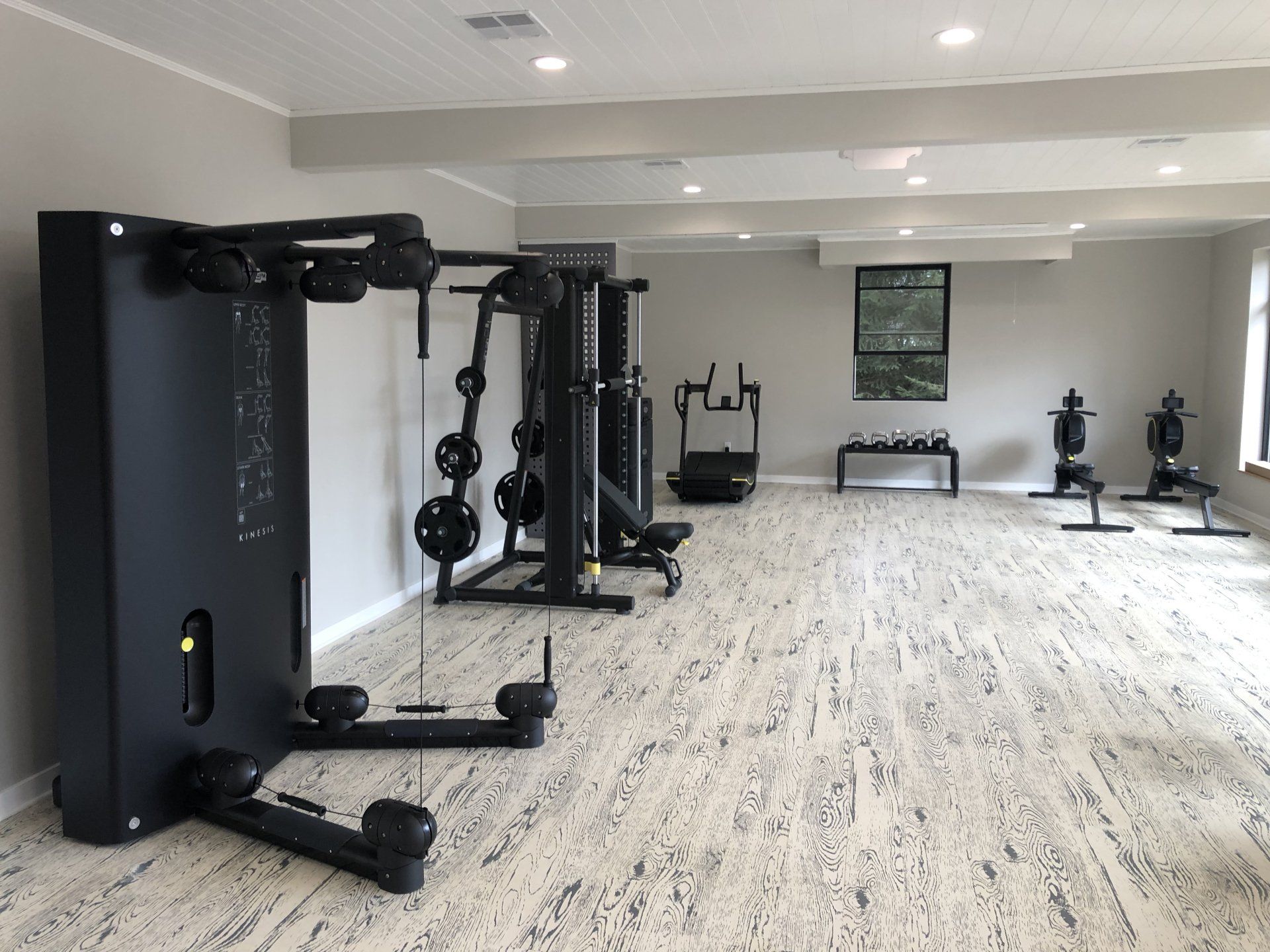 Functional trainer and workout machines inside Daily Fitness gym