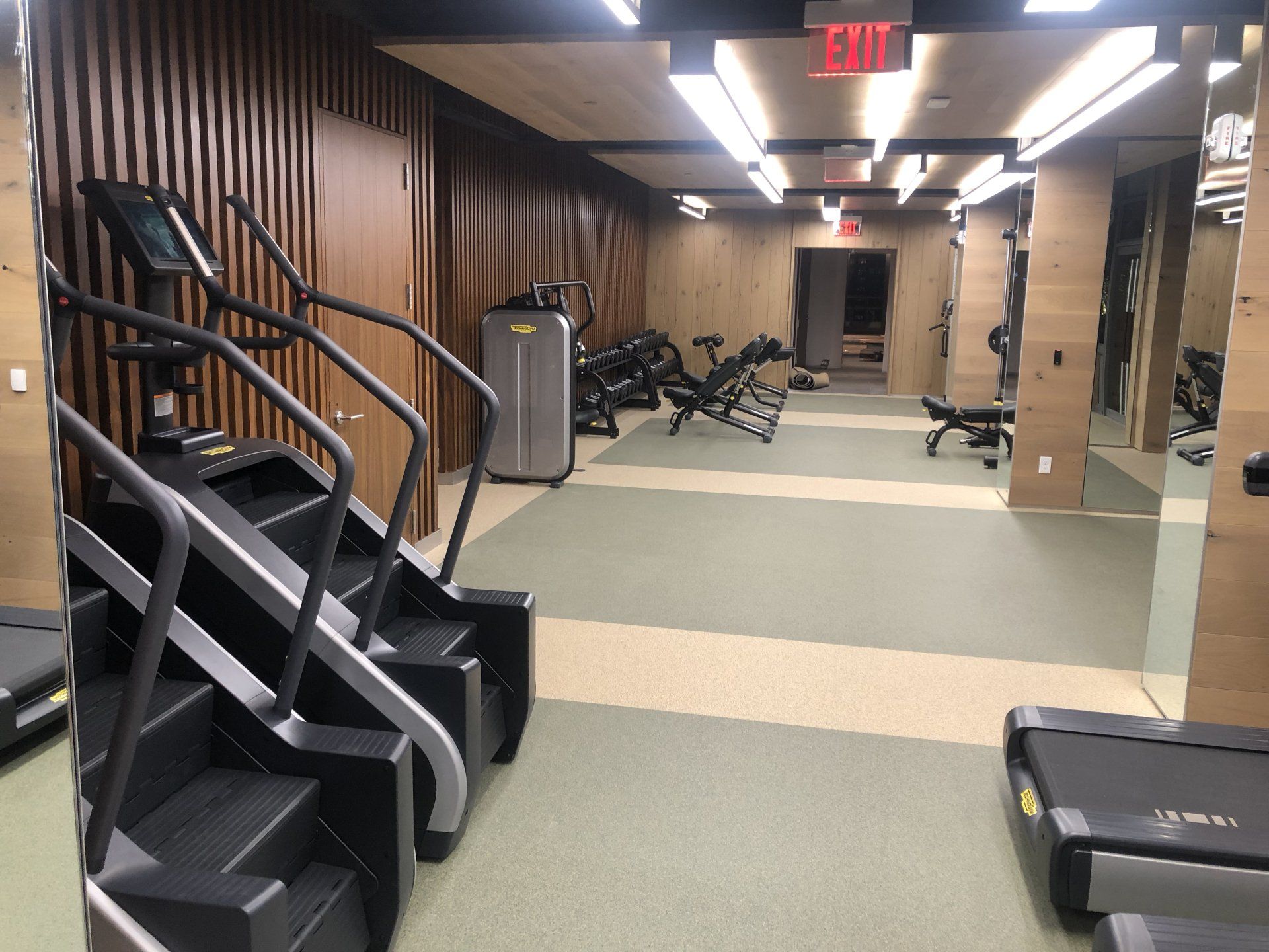 Stair climber machines and workout stations at Iron State fitness center.