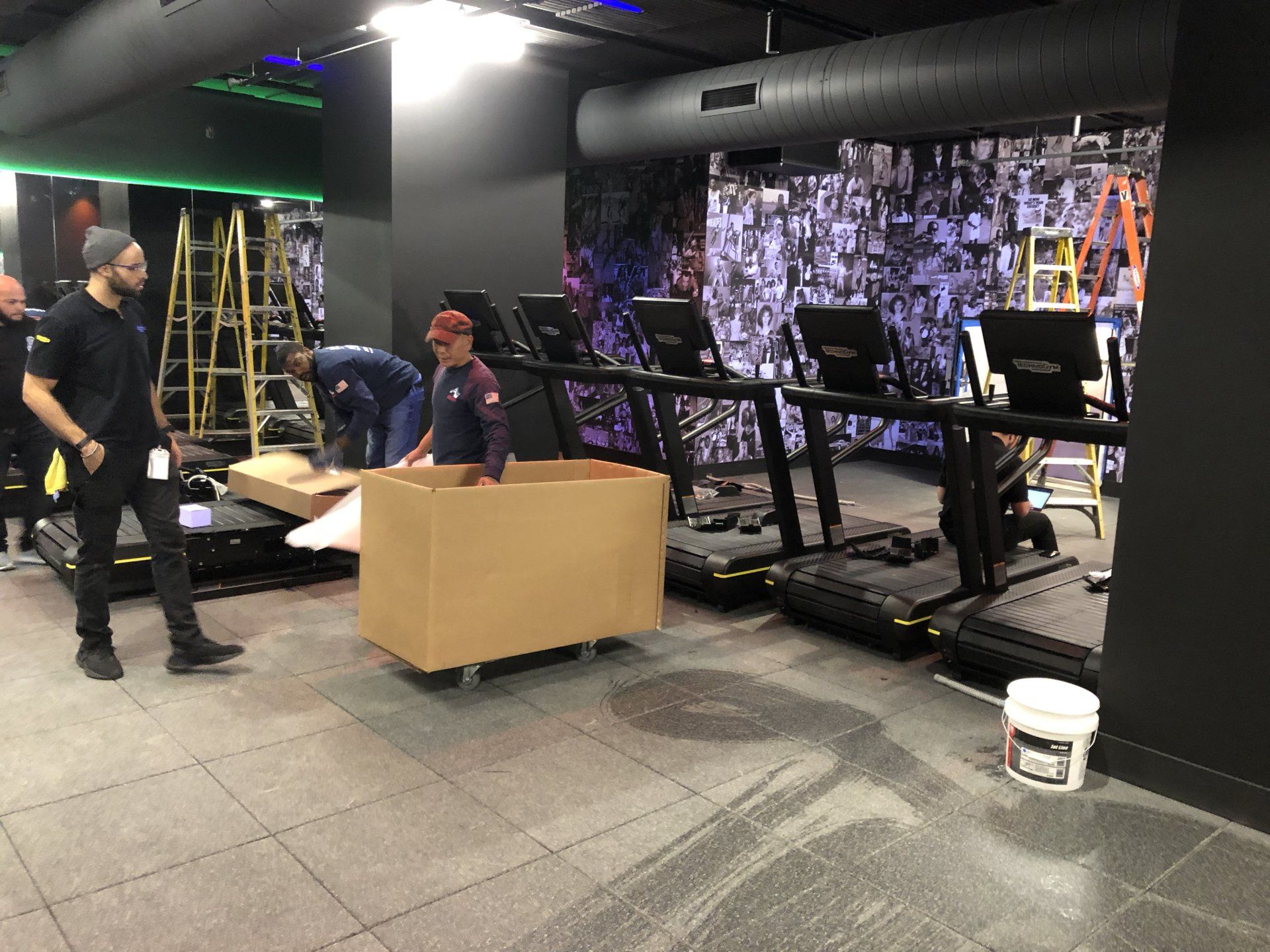 Rumble Fitness interior with equipment boxes and unfinished gym setup