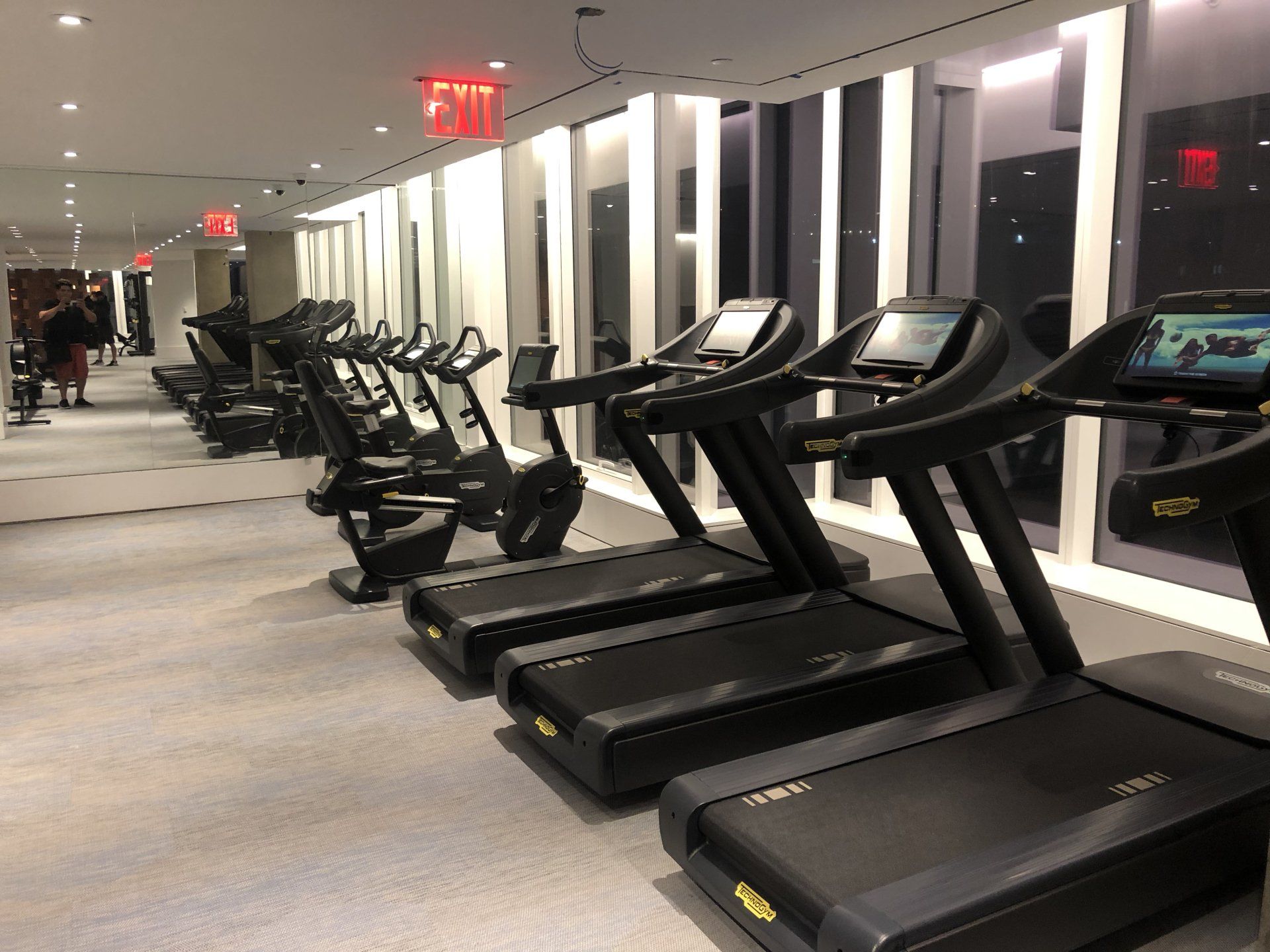 Cardio treadmills in luxury Williamsburg apartment fitness center.