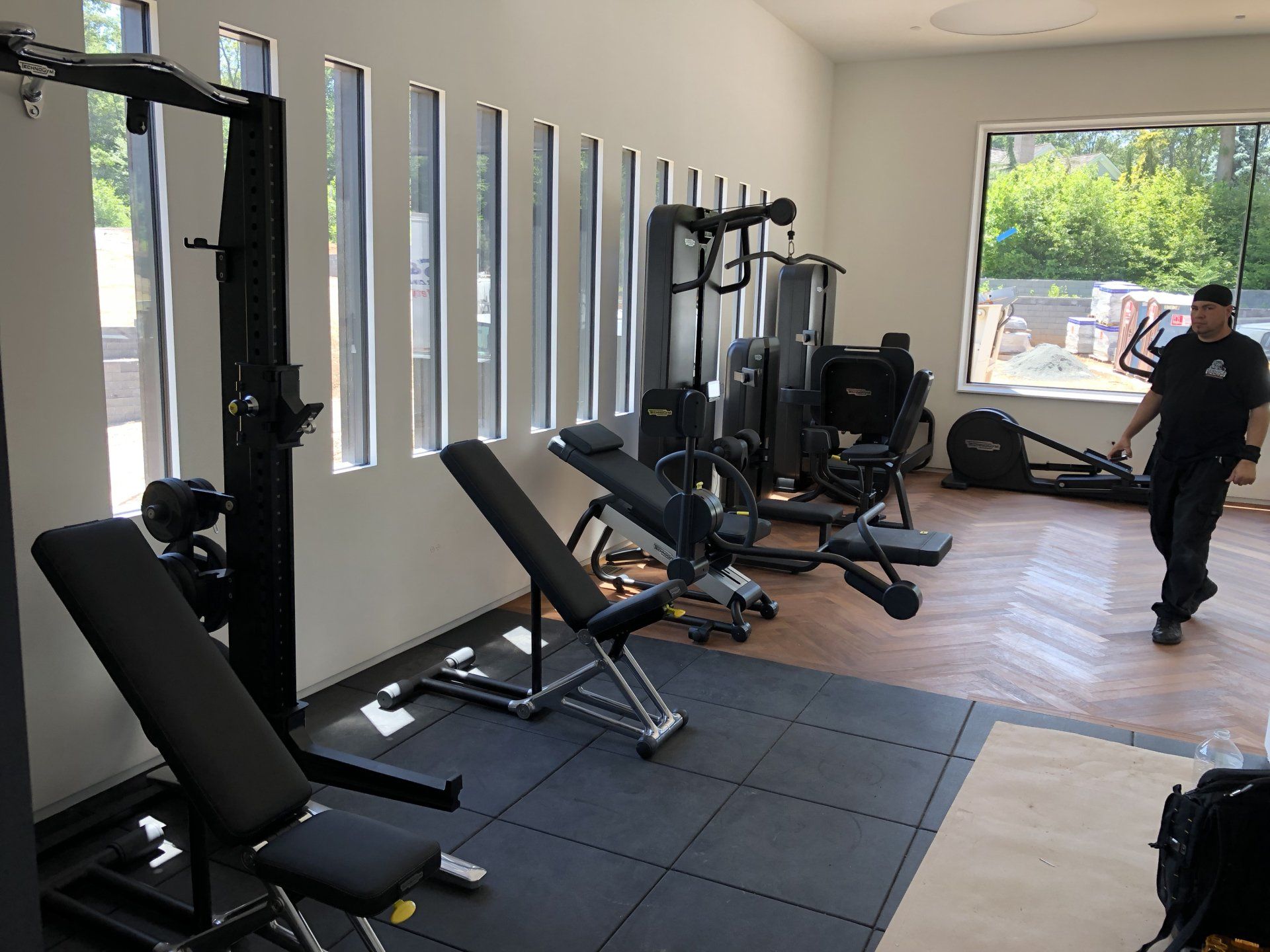 Home gym installation in Bernardsville residential build with new strength training equipment.