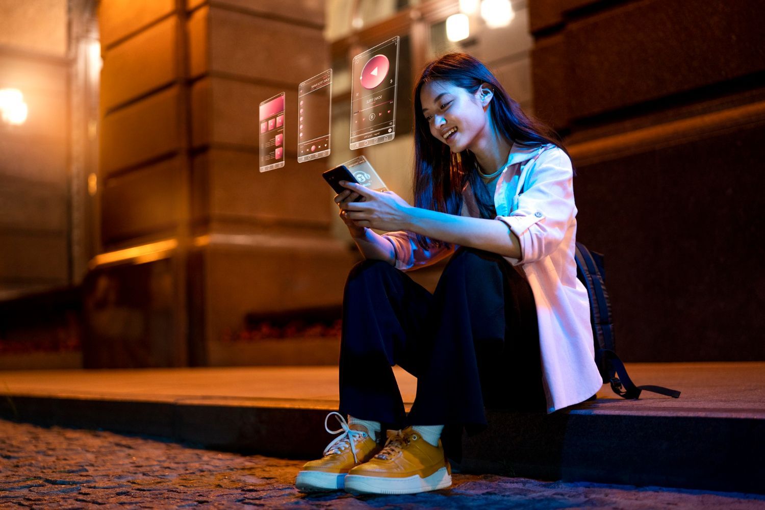 A woman is sitting in a chair with a microphone and a tablet.