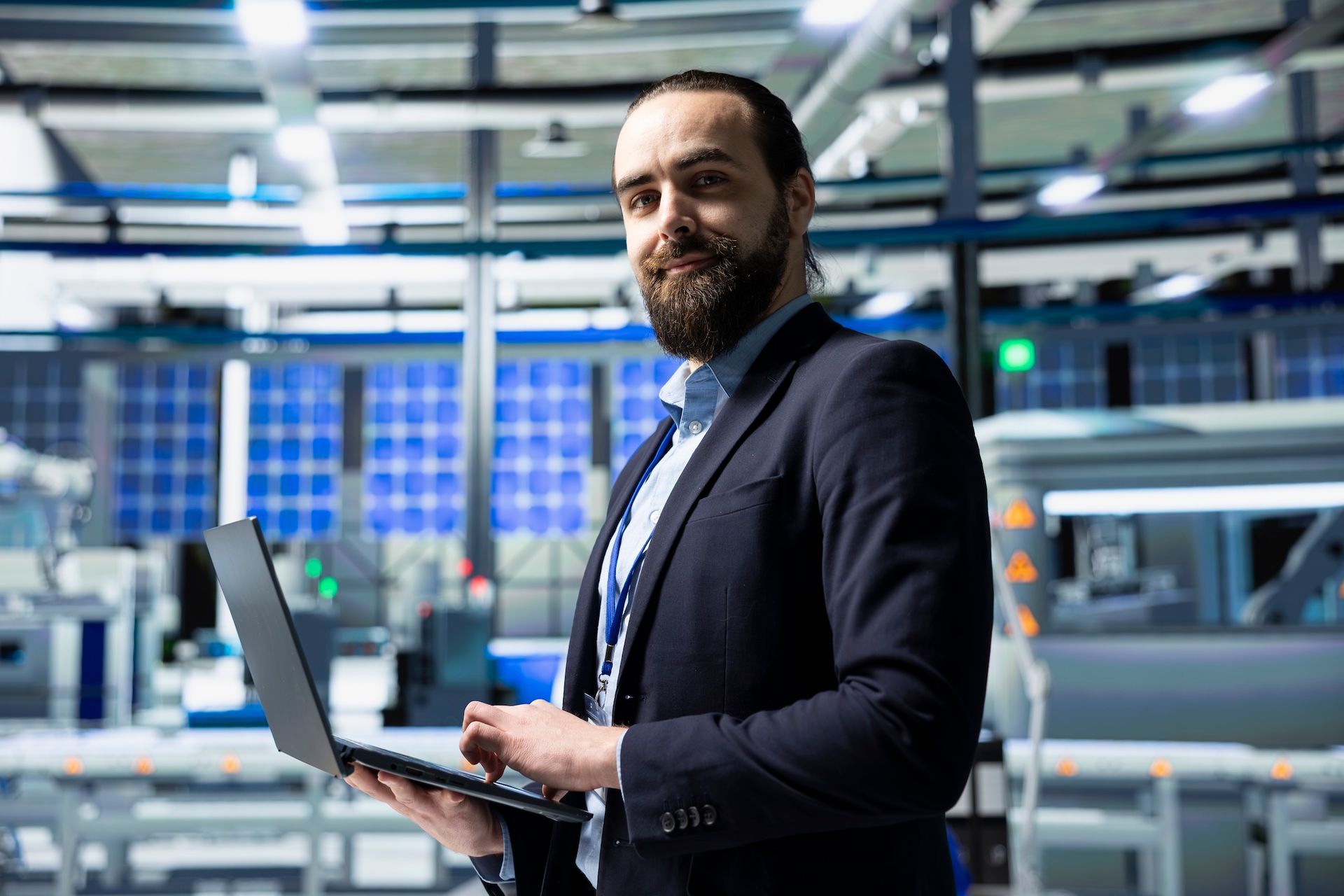 People seated around a wooden table in an office, reviewing documents. White walls, black accent wall.