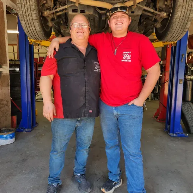 Rock’s Tire & Auto Staff Standing In Service Bay | Rock's Tire & Auto
