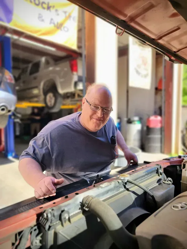 Auto Technician Performing Vehicle Service In Repair Bay | Rock's Tire & Auto