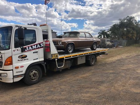 Tow Truck with Classic Car on Back — Automotive Repairs  in Blackwater, QLD