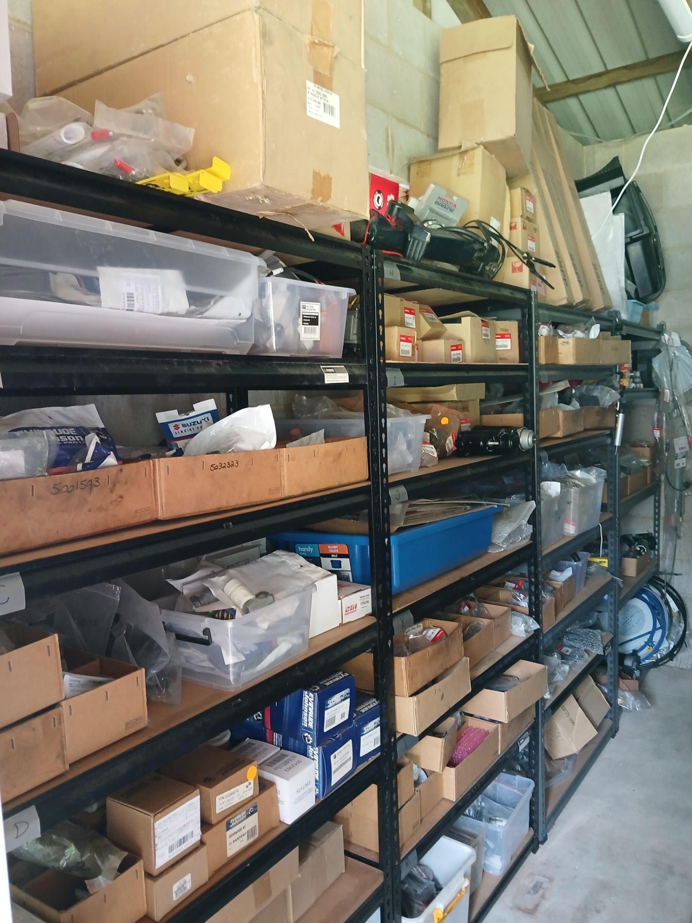 Inside a warehouse with parts— Cannonvale Marine In Jubilee Pocket, QLD