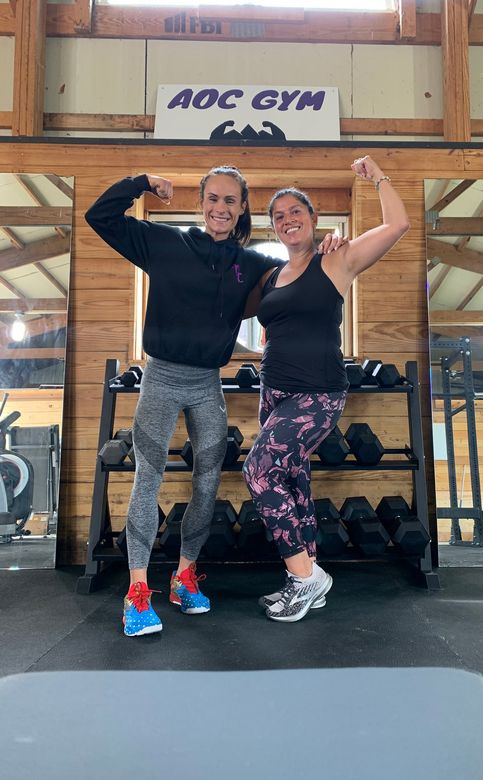 Women Showing Muscles — Monee, IL — K-Ray Fitness At AOC Gym