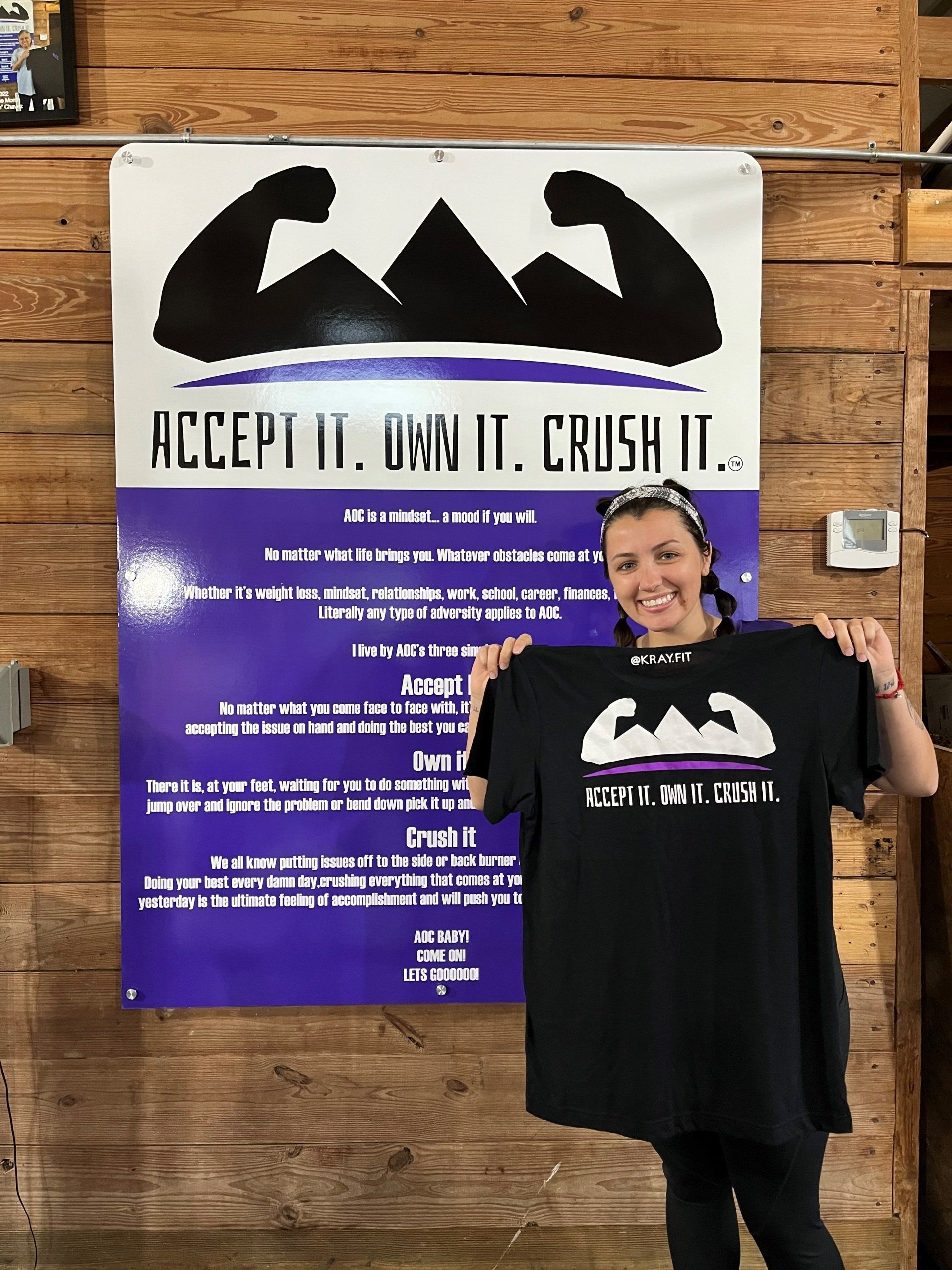 Holding A Shirt — Monee, IL — K-Ray Fitness At AOC Gym