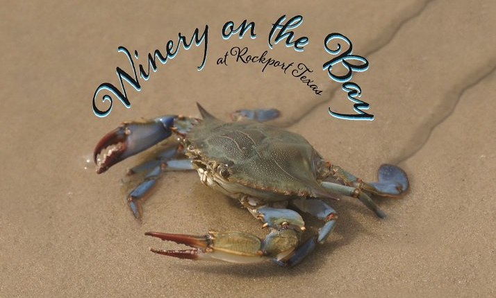 A winery on the bay logo with a crab on the sand