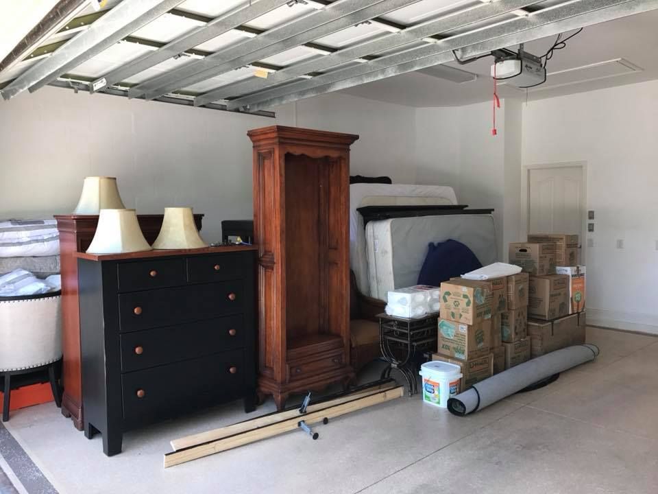 A garage filled with lots of furniture and boxes.