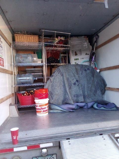 The inside of a moving truck filled with lots of items