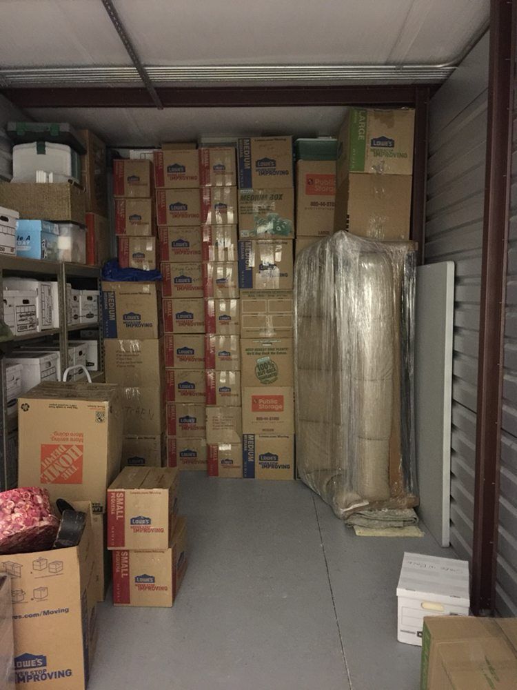 A room filled with boxes including one that says home depot