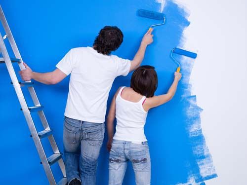 Professional painting the wall in Rochester, NY